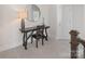 Stylish hallway showcasing a wooden desk and chair illuminated by an elegant lamp at 4861 Blanchard Way, Charlotte, NC 28226