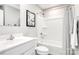 Clean bathroom with white vanity, tub shower, and black and white shower curtain at 5235 Stevedore Way, Charlotte, NC 28269