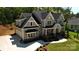 High angle view of a stately two-story home with a lush green lawn and a two-car garage at 6178 Chimney Bluff Rd, Lancaster, SC 29720