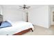 A simplistic bedroom featuring carpet flooring and a door leading into the bathroom at 6178 Chimney Bluff Rd, Lancaster, SC 29720