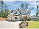 Stylish two-story home with gray siding, a stone accents, a covered porch, and a well-kept lawn at 6178 Chimney Bluff Rd, Lancaster, SC 29720