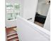 Hallway leading to bedroom with hardwood floors and white walls at 6178 Chimney Bluff Rd, Lancaster, SC 29720