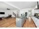 Open concept kitchen featuring white cabinets, granite counters, stainless steel appliances, and an island at 6178 Chimney Bluff Rd, Lancaster, SC 29720