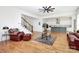 Inviting living room with hardwood floors, staircase, and view into the kitchen at 6178 Chimney Bluff Rd, Lancaster, SC 29720