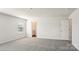 Large bedroom with neutral carpet and large window at 210 Giant Oak Ave, Statesville, NC 28677