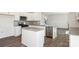 Modern kitchen featuring white cabinets, stainless steel appliances, and granite countertops at 210 Giant Oak Ave, Statesville, NC 28677