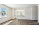 Open living room features lots of natural light and hardwood floors at 210 Giant Oak Ave, Statesville, NC 28677