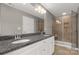 Bathroom featuring double sinks, granite countertop, and a shower at 5051 Oxbow Run Ln, Clover, SC 29710