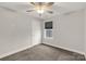 Bright bedroom with window and ceiling fan at 5051 Oxbow Run Ln, Clover, SC 29710