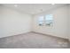 Spacious bedroom with neutral carpeting and large windows at 730 Olde England Dr, Lincolnton, NC 28092