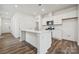 Modern kitchen with white cabinets, an island, and stainless steel appliances at 730 Olde England Dr, Lincolnton, NC 28092