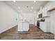 Modern kitchen with white cabinets and a large island at 730 Olde England Dr, Lincolnton, NC 28092