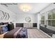 Spacious bedroom with neutral decor, featuring a comfortable bed and plenty of natural light at 8104 Haidas Ave # 036, Charlotte, NC 28214