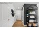 Bright entryway with hardwood floors and stylish shelving at 8104 Haidas Ave # 036, Charlotte, NC 28214
