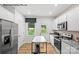 Modern kitchen with stainless steel appliances and kitchen island at 8104 Haidas Ave # 036, Charlotte, NC 28214