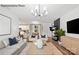 Open concept living room with views into the kitchen and dining area at 8104 Haidas Ave # 036, Charlotte, NC 28214