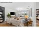 Spacious living room featuring a comfortable sectional sofa and large TV at 8104 Haidas Ave # 036, Charlotte, NC 28214