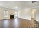 Spacious living room with a cozy fireplace, hardwood floors, and abundant natural light at 8708 Frank Grier Rd # 53, Charlotte, NC 28215