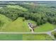 Aerial view of an estate with large lot with mature trees, and long private driveway at 720 Miller Chapel Rd, Salisbury, NC 28147