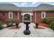 A decorative fountain highlights the covered rear entrance to this stately brick home at 720 Miller Chapel Rd, Salisbury, NC 28147