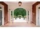 View of an outdoor patio with white columns and a decorative fountain at 720 Miller Chapel Rd, Salisbury, NC 28147