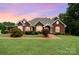 Charming brick home with manicured lawn, mature landscaping, and warm inviting curb appeal at 720 Miller Chapel Rd, Salisbury, NC 28147