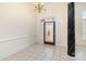 Elegant foyer featuring a decorative front door, tile flooring, and decorative chandelier at 720 Miller Chapel Rd, Salisbury, NC 28147