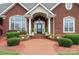 Close-up of the front entrance with classic pillars and manicured landscaping at 720 Miller Chapel Rd, Salisbury, NC 28147