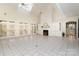 Bright living room features tile flooring, fireplace, built-in cabinets, and french doors to the exterior at 720 Miller Chapel Rd, Salisbury, NC 28147