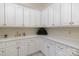 Pantry area includes lots of storage, recessed lighting, and a white sink and cabinets with gold hardware at 720 Miller Chapel Rd, Salisbury, NC 28147