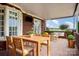 Outdoor patio with dining table, chairs, sofa and manicured greenery and landscaping at 720 Miller Chapel Rd, Salisbury, NC 28147