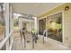 Screened porch with glass table and chairs, view of yard at 7026 Quail Hill Rd, Charlotte, NC 28210