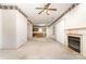 Open living room with a view of the kitchen and fireplace at 9318 Lake Spring Ave, Charlotte, NC 28216