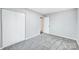 Simple bedroom with grey carpet and double door closet at 1308 Rama Rd, Charlotte, NC 28211