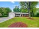 Brick ranch home with attached garage and spacious yard at 1308 Rama Rd, Charlotte, NC 28211