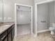 Bathroom with tile flooring, granite vanity, and a view into the main bedroom at 2009 Atherton Dr, Indian Trail, NC 28079