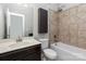 A bathroom has a tiled shower/tub and single sink vanity at 2009 Atherton Dr, Indian Trail, NC 28079