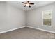 A simple bedroom with a ceiling fan, natural light, and neutral paint at 2009 Atherton Dr, Indian Trail, NC 28079