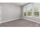 A bedroom with three windows allowing for ample natural light at 2009 Atherton Dr, Indian Trail, NC 28079