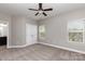 A light-filled room with a ceiling fan, neutral paint, and plush carpeting, is move-in ready at 2009 Atherton Dr, Indian Trail, NC 28079