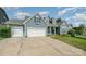 Charming home with a three-car garage, long driveway, and green lawn at 2009 Atherton Dr, Indian Trail, NC 28079