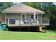 View of a large deck, backyard, grill, and exterior of the home at 436 E Oakwood Ave, Albemarle, NC 28001