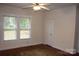 Bright bedroom features wood floor, ceiling fan and natural light from double windows at 436 E Oakwood Ave, Albemarle, NC 28001