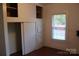 Bedroom features built-in storage with drawers and shelves and a window for natural light at 436 E Oakwood Ave, Albemarle, NC 28001