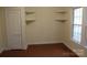 Cozy bedroom with a window and built-in shelving at 436 E Oakwood Ave, Albemarle, NC 28001