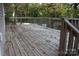 Spacious wooden deck perfect for outdoor enjoyment, surrounded by a lush green landscape and foliage at 436 E Oakwood Ave, Albemarle, NC 28001