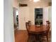 Inviting dining room with a wooden table and chairs, and a view into the bedroom at 436 E Oakwood Ave, Albemarle, NC 28001