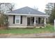 Charming single-story home featuring a cozy porch with stone accents and neutral siding at 436 E Oakwood Ave, Albemarle, NC 28001