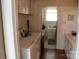 Bright laundry area with washer, dryer, and access to the bathroom at 436 E Oakwood Ave, Albemarle, NC 28001
