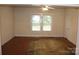 Bright living room with a ceiling fan and plush area rug at 436 E Oakwood Ave, Albemarle, NC 28001